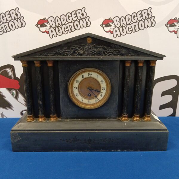 Antique Victorian slate mantle clock with Roman numeral dial.