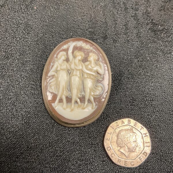 Victorian shell cameo brooch depicting the Three Graces in silver.