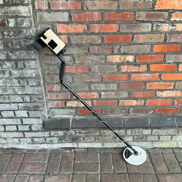 Viking 8mx metal detector with search coil visible.
