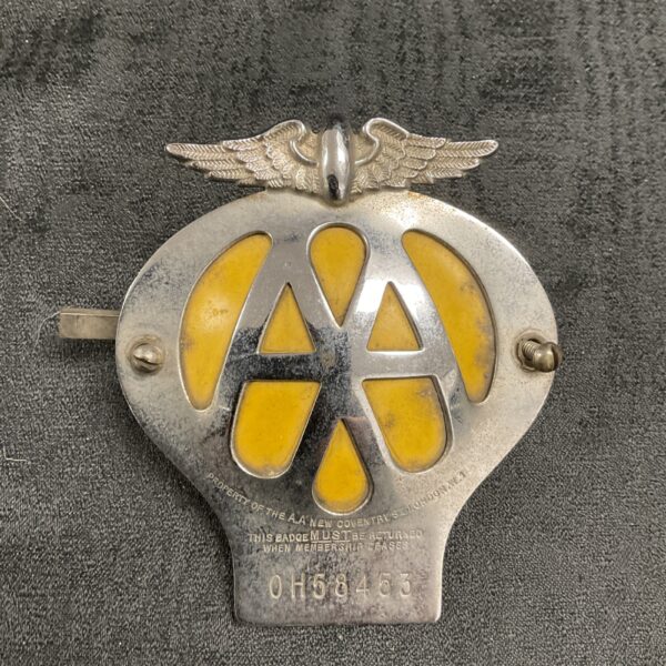 Vintage AA car grill badge, classic automotive emblem for collectors.