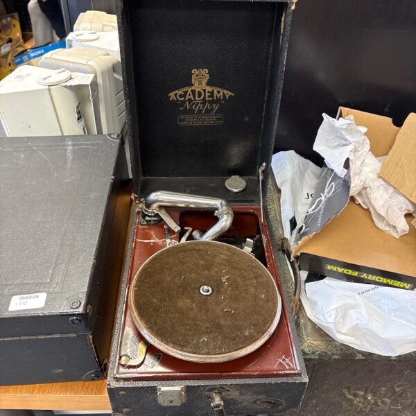 Vintage Academy Nippy gramophone with wooden cabinet and metal horn.