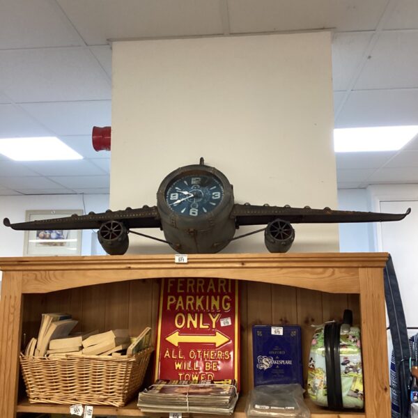 Vintage aeroplane wall clock, aviation decor, retro timepiece.