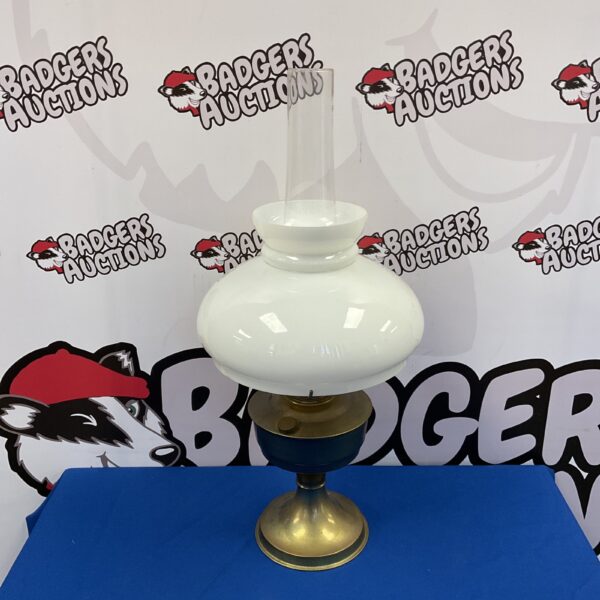 Vintage Aladdin paraffin lamp with brass base and glass shade.