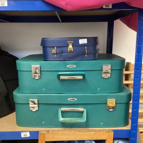 Vintage green and blue Antler suitcases, retro travel luggage.