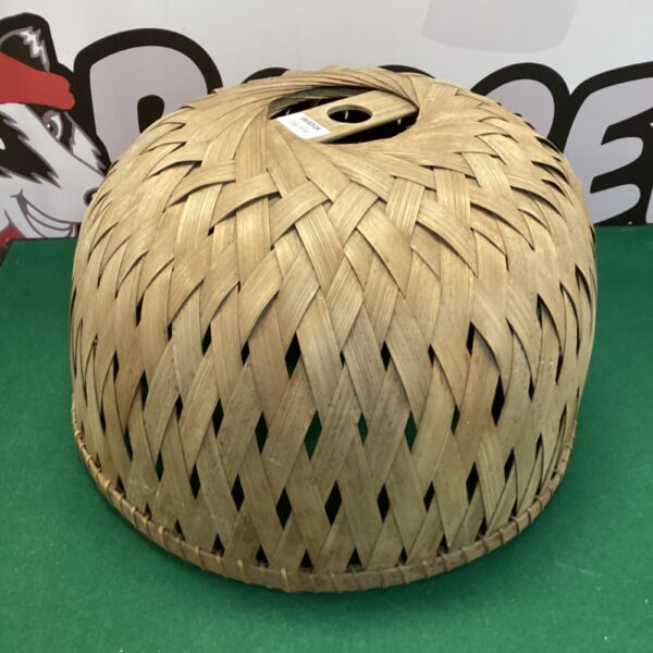 Vintage woven bamboo lamp shade with a natural texture.