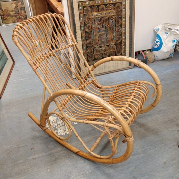 Vintage bamboo rocking chair with woven seat and back.
