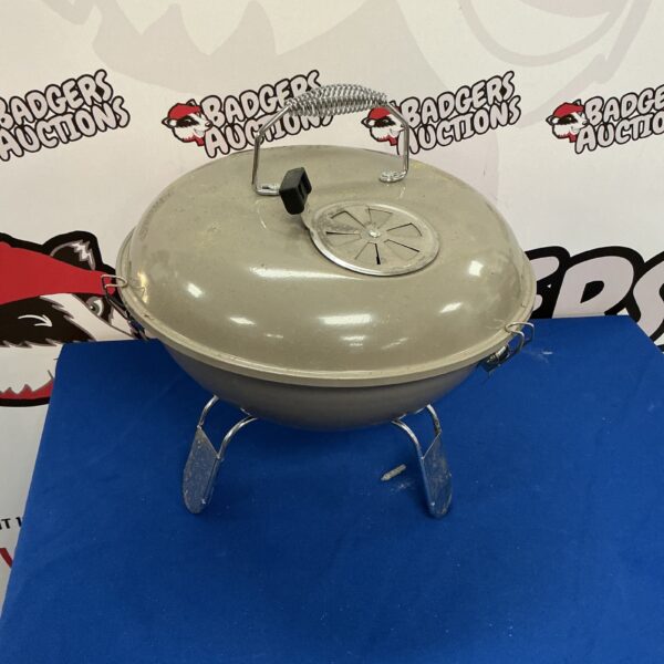 Vintage enamel BBQ grill for outdoor cooking and collecting.