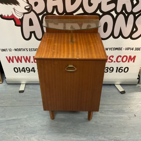 Small vintage wooden bedside table with a single drawer.