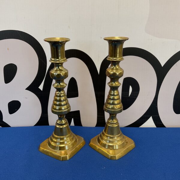 Pair of vintage brass candlesticks with fluted stems.