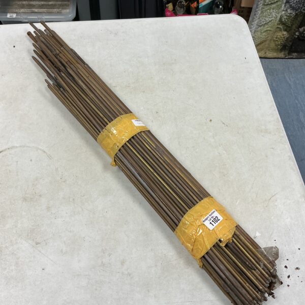 Vintage brass stair rods in unrestored condition, ideal for restoration.