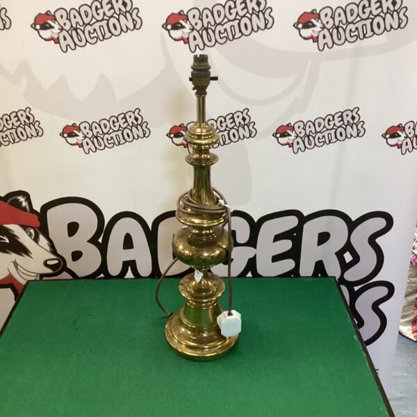 Vintage brass table lamp awaiting restoration, classic antique lighting.