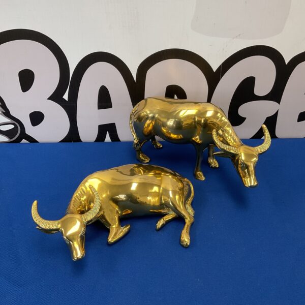 Vintage brass water buffalo statues, detailed animal figurines for home decor.