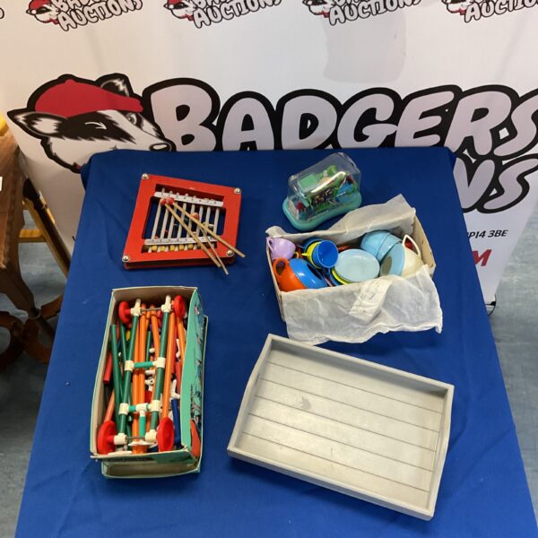 Colourful vintage building set with wooden rods and connectors.