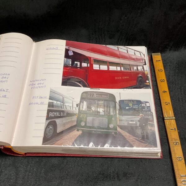 Vintage photograph of a red double-decker bus and a green coach.