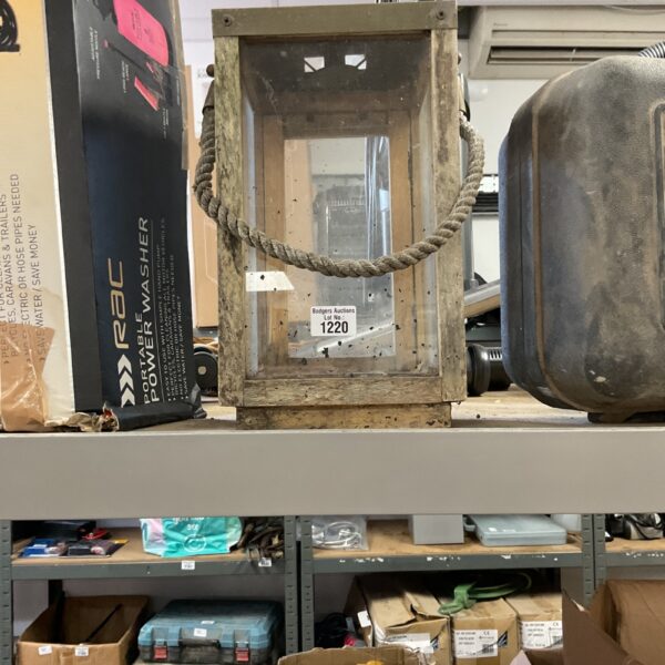 Vintage metal candle lantern with weathered patina.
