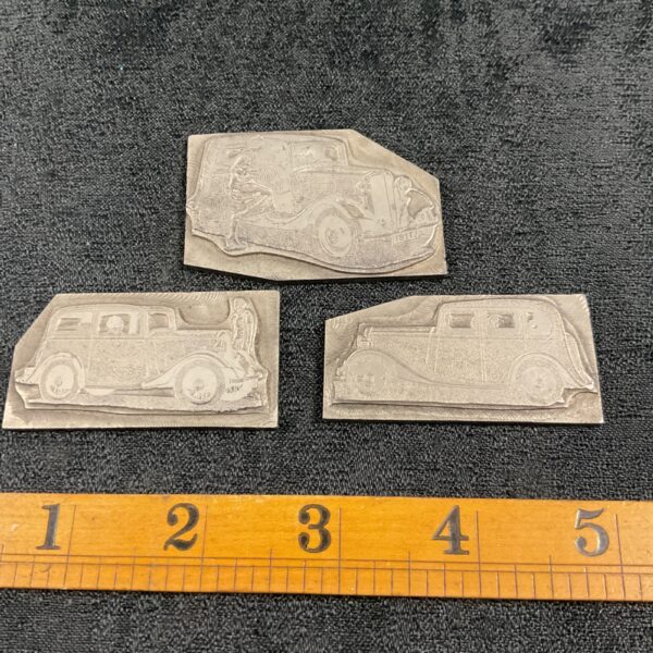 Vintage metal printing plates depicting a classic Standard car.