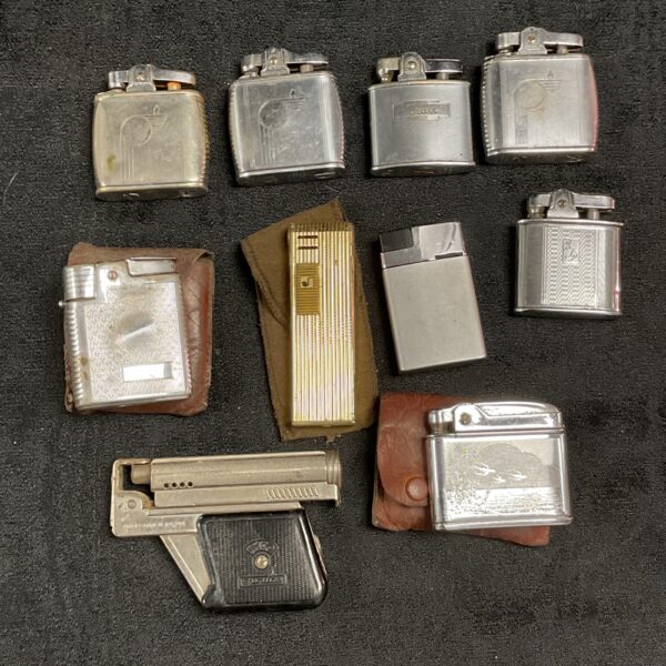 Vintage cigarette lighters collection, including potential Ronson examples.