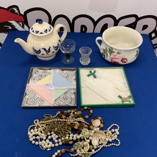 Vintage collectible lot featuring ceramics, linen, and jewellery.