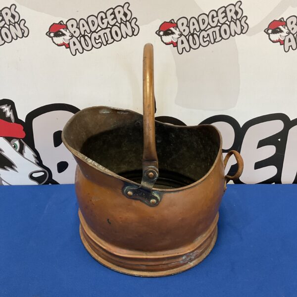Vintage copper coal scuttle with handle, antique fireplace accessory.