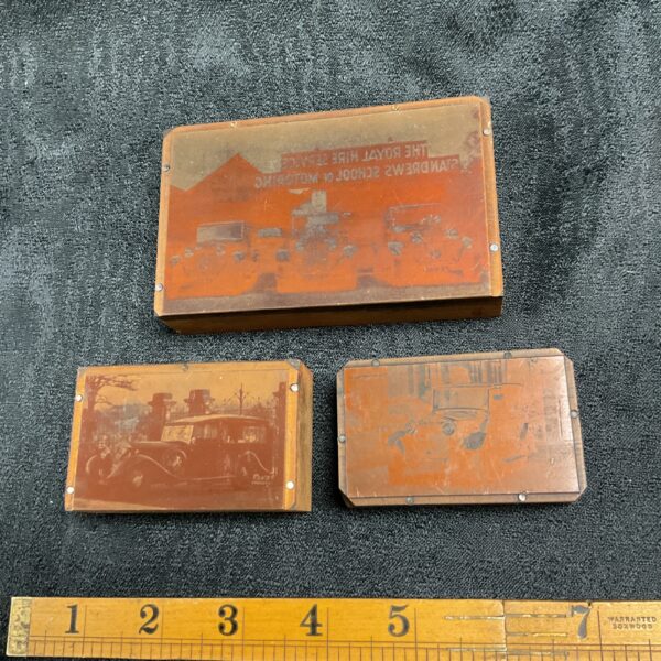 Vintage copper printing blocks depicting 1930s automobiles for letterpress.