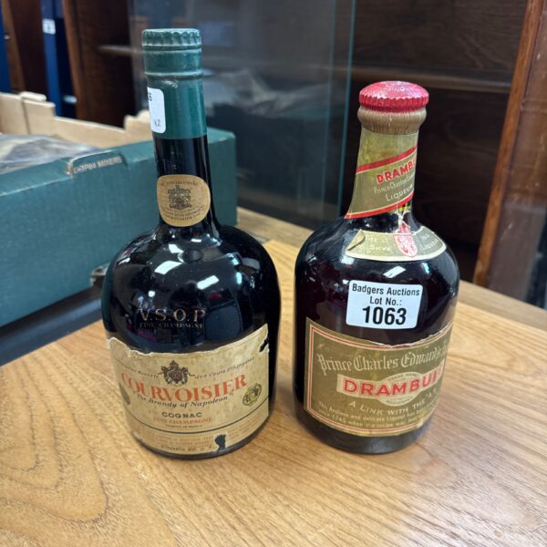 Vintage Courvoisier and Drambuie bottles, antique liquor collection.