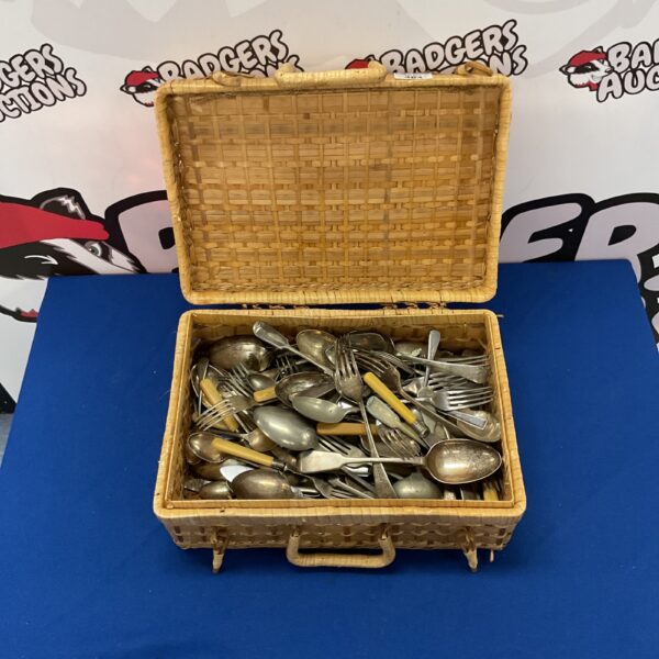 Vintage cutlery basket with silver plated set inside.