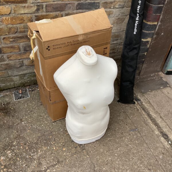 Vintage dressmaker manikin in cardboard packaging.