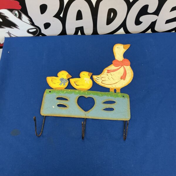 Vintage metal duck coat hook with ducklings, wall mounted.