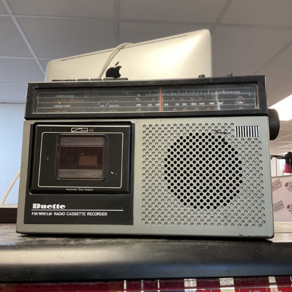 Front view of a vintage Duette portable cassette radio.
