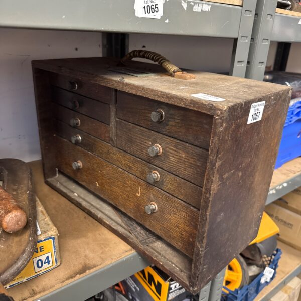 Vintage wooden engineers toolbox with visible wear and tear.