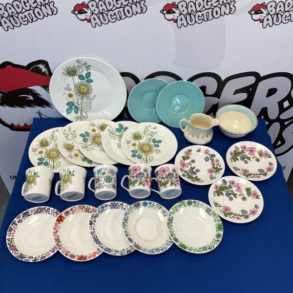 Vintage floral china collection featuring teacups and saucers.