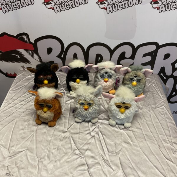 Lot of seven vintage Furbys, collectible electronic toys.