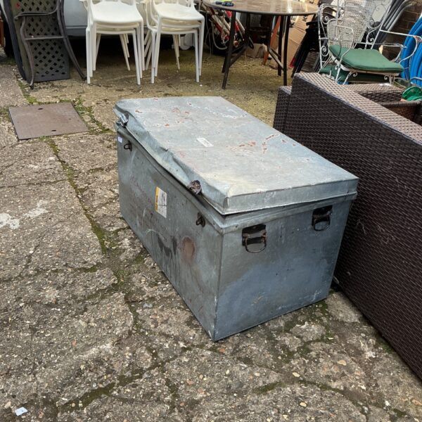 Weathered vintage galvanised chest with handles, ideal for storage.