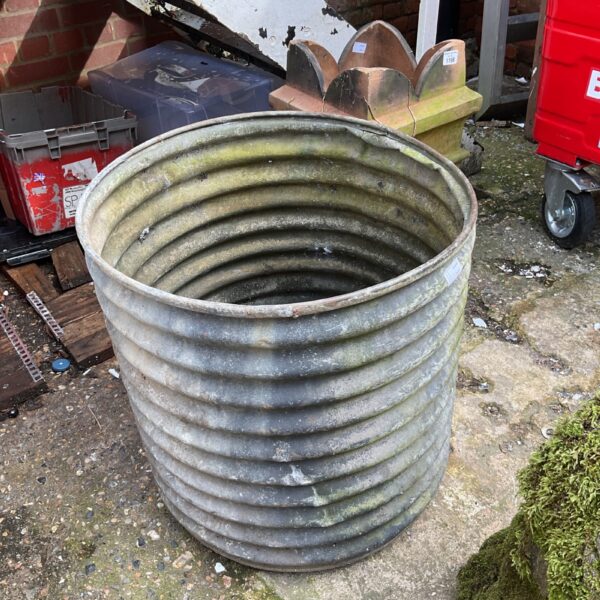 Weathered vintage galvanised drum, ideal for garden or industrial decor.
