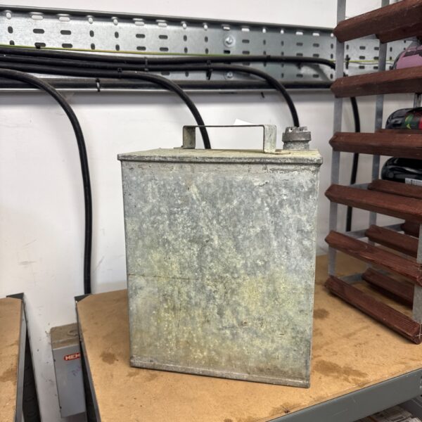 Vintage galvanised fuel can, showing signs of age and wear.