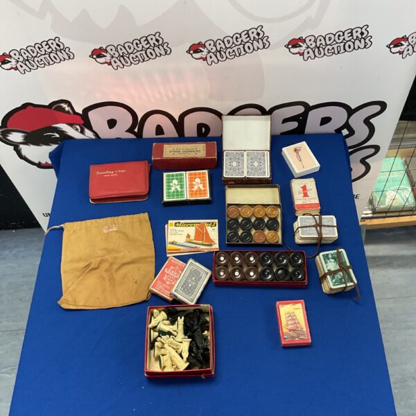 Overview of a vintage games lot including chess, cards and dominoes.