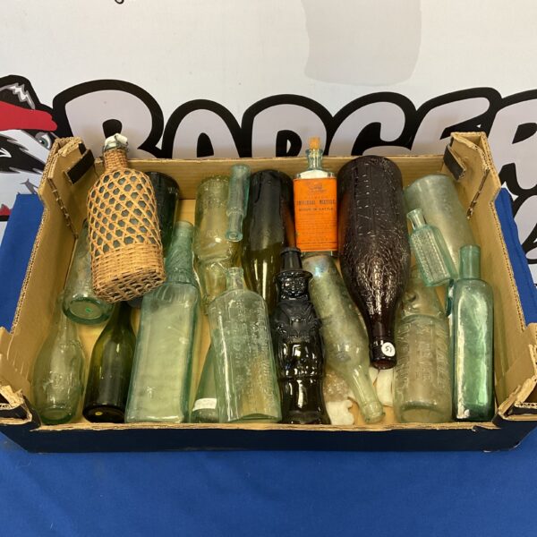 Vintage glass bottle collection with colourful antique bottles.