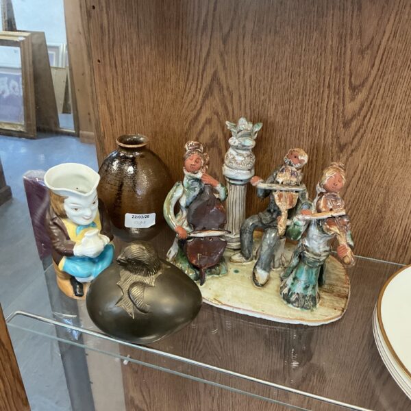 Vintage glazed pottery musicians collection, detailed ceramic figurines.