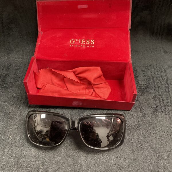 Vintage Guess sunglasses in red presentation box.