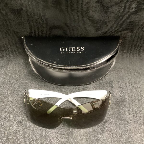 Front view of vintage Guess sunglasses, retro fashion accessory.