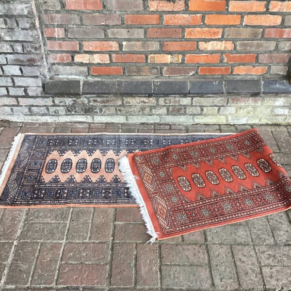 Vintage handwoven runner rug with geometric patterns.
