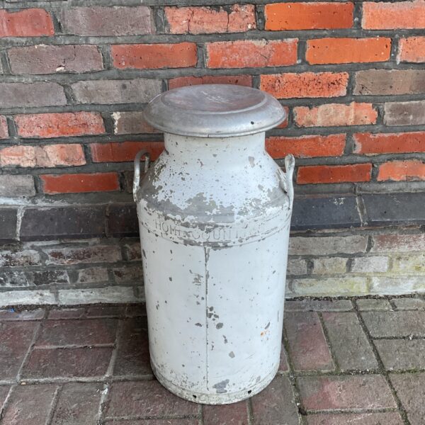 Vintage Home Counties milk churn, a collectible dairy item.