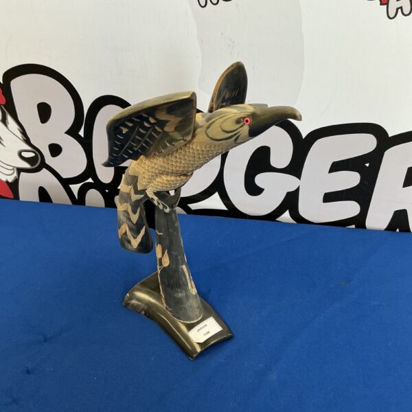 Vintage horn bird figurine, detailed carving, folk art style.