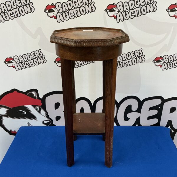 Vintage wooden jardiniere stand with octagonal top.