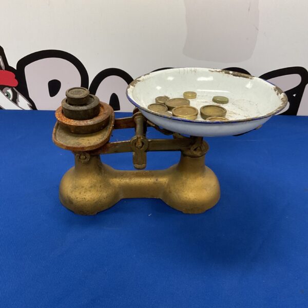 Vintage cast iron kitchen scales with enamel dish and weights.