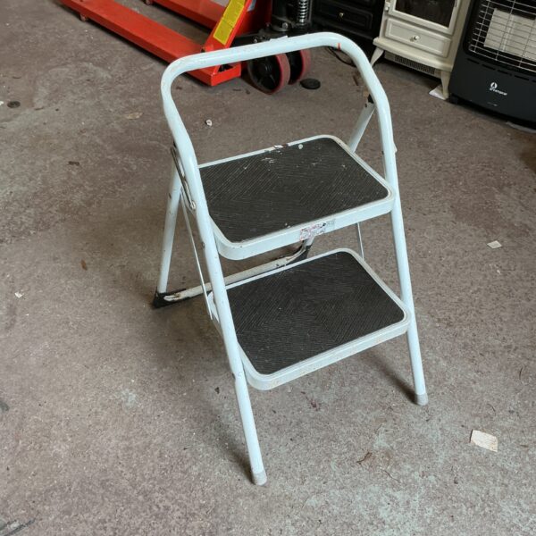Vintage metal kitchen step ladder for home use.