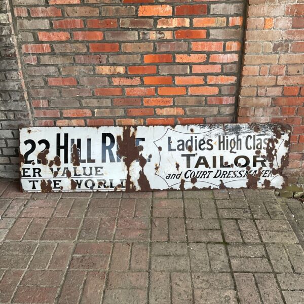 Vintage enamel sign for a ladies tailor shop.