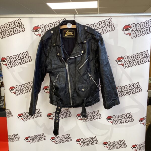 Front view of a vintage leather jacket with quilted shoulders.