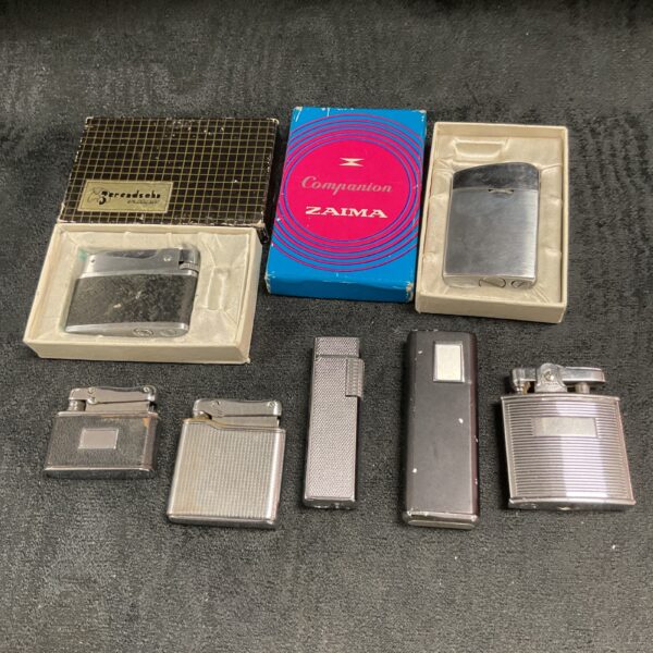 Vintage lighters collection including Colibri, retro smoking accessories.