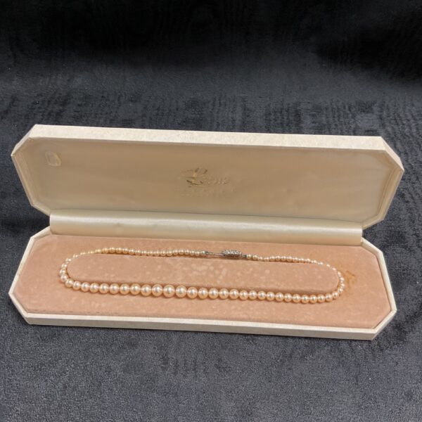 Vintage Lotus faux pearl necklace in original box.